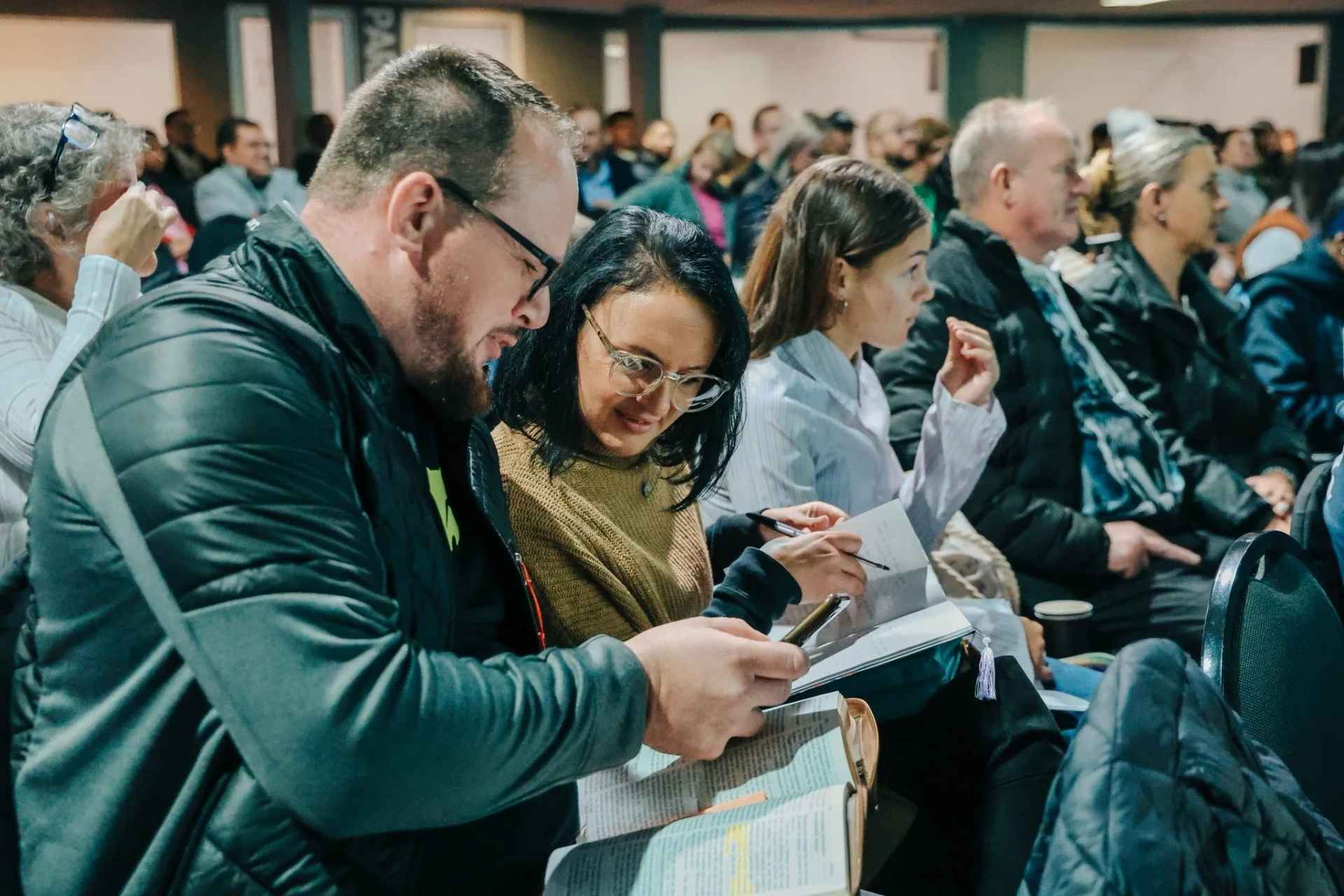 Members studying the Bible during a Sunday gathering at Christ Gen Church, a Bible teaching church in Cape Town