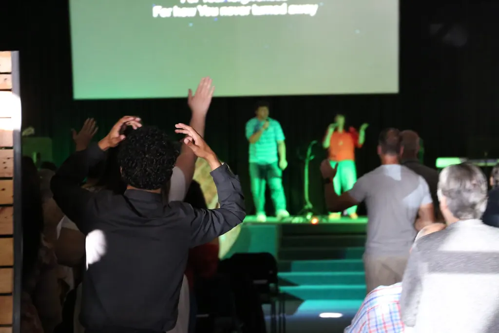 Sunday worship service at Christ Gen Church Strand with members praising God in one of the growing churches in Strand Western Cape
