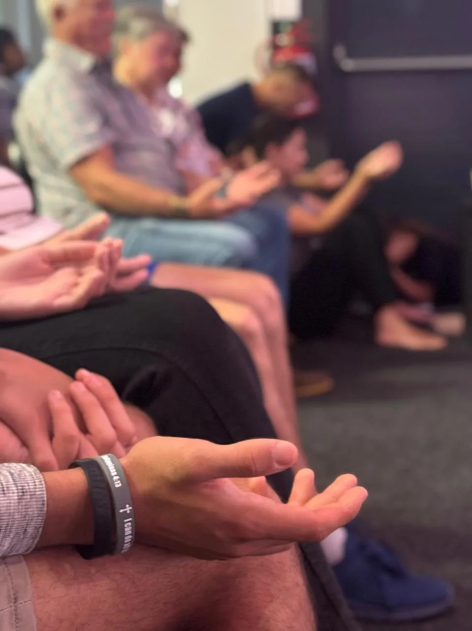 Members praying during a worship gathering at Christ Gen Kleinmond, a Christ-centred church community in Kleinmond