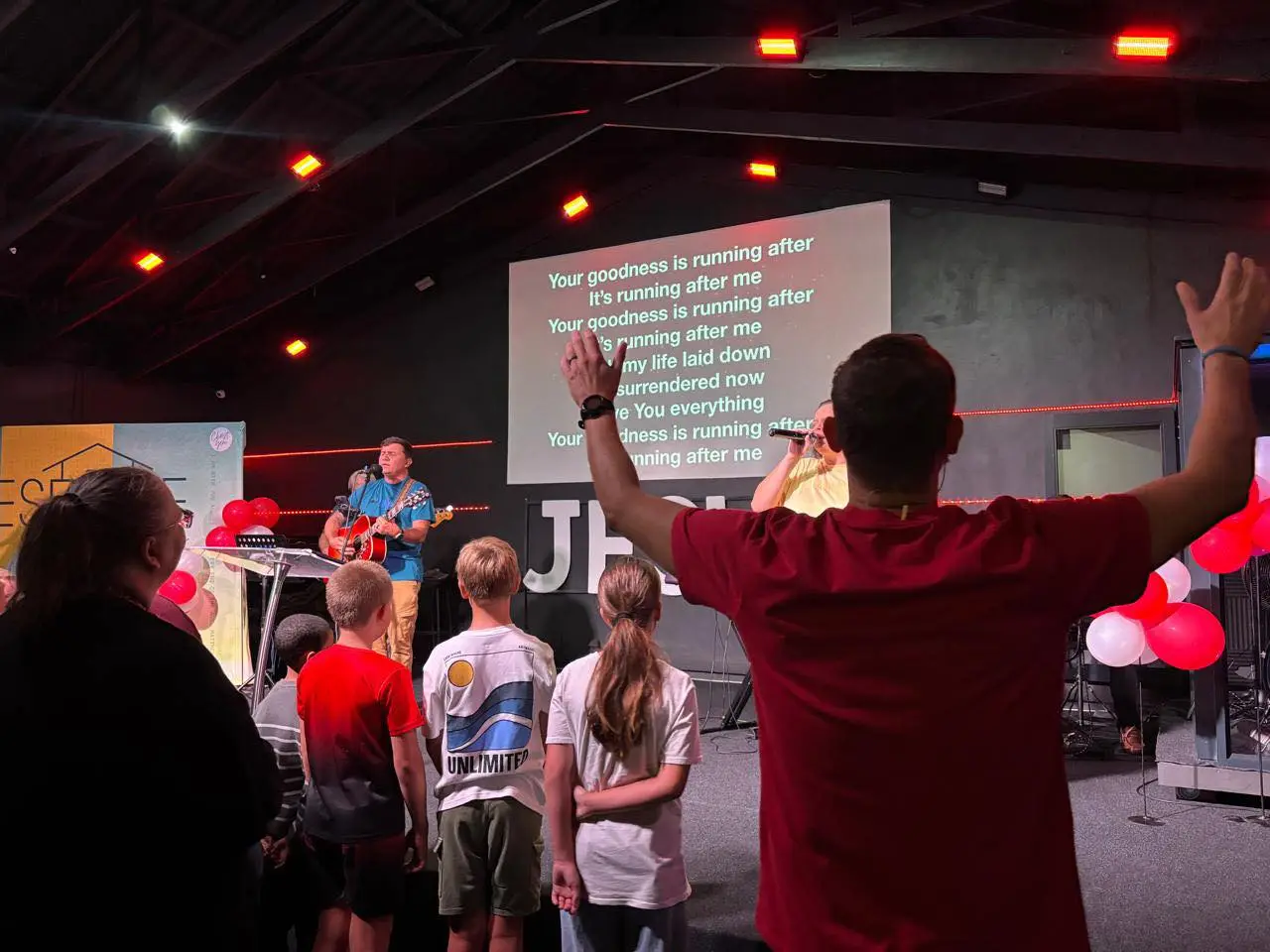 Families worshipping together during a Sunday gathering at Christ Gen Kleinmond in the Western Cape