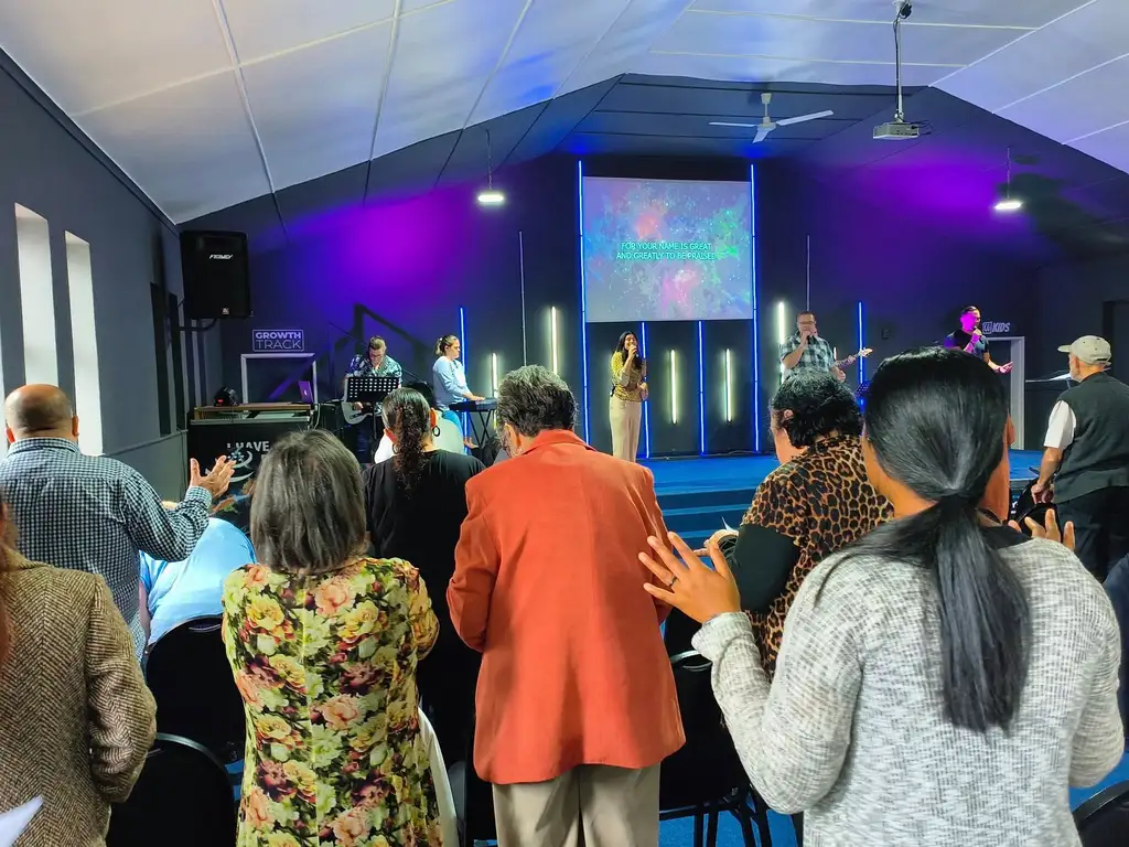 Worship gathering at Christ Gen Lakeside with members praising God during a Sunday church service