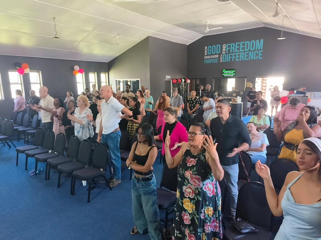 Members worshipping together at Christ Gen Lakeside during a Sunday church service focused on faith and community