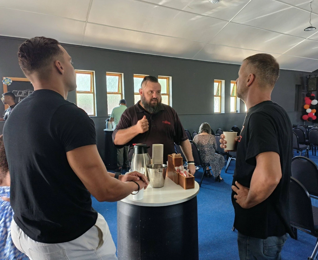 Church members connecting over coffee and fellowship at Christ Gen Lakeside community gathering