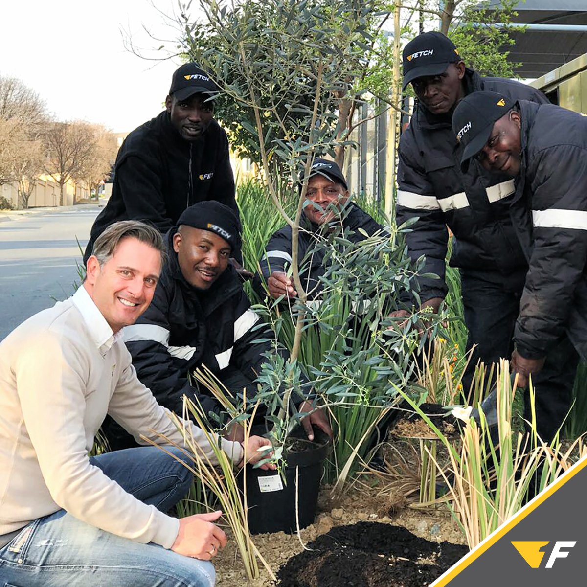Picture-of-Jason-an-team-planting-tree